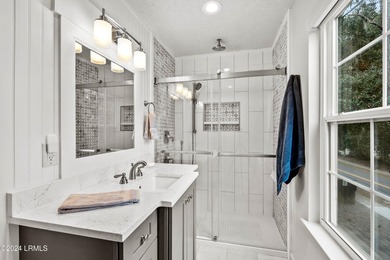 Beautifully upgraded, modern coastal home with new roof, new - photo 37