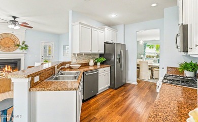 Welcome to this inviting 3-bedroom, 2.5-bath home nestled in the - photo 20