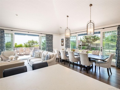 Set along the coveted shores of Dune Road in Quogue, this - photo 11