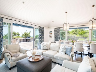 Set along the coveted shores of Dune Road in Quogue, this - photo 12