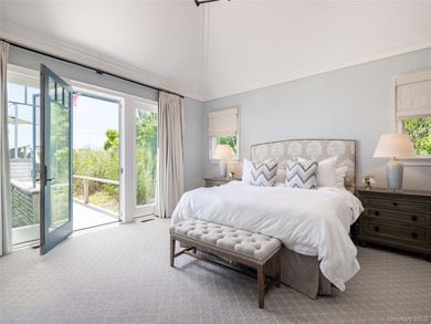 Set along the coveted shores of Dune Road in Quogue, this - photo 13