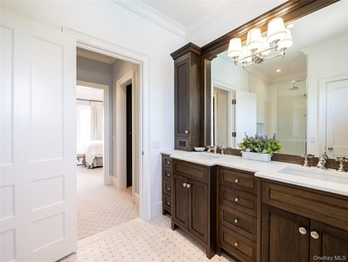 Set along the coveted shores of Dune Road in Quogue, this - photo 14