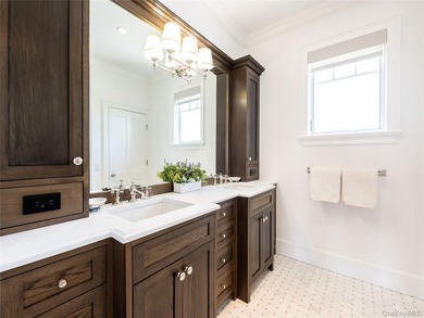 Set along the coveted shores of Dune Road in Quogue, this - photo 15