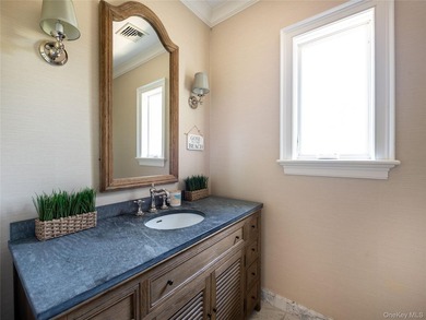 Set along the coveted shores of Dune Road in Quogue, this - photo 17