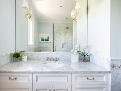 Set along the coveted shores of Dune Road in Quogue, this - photo 19