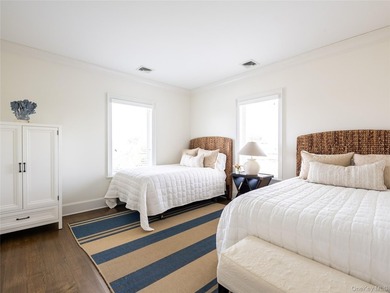 Set along the coveted shores of Dune Road in Quogue, this - photo 20