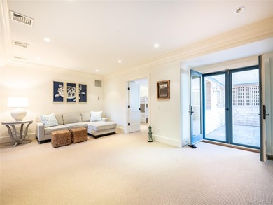 Set along the coveted shores of Dune Road in Quogue, this - photo 21