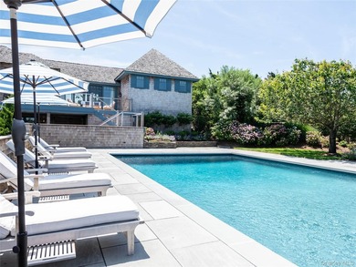 Set along the coveted shores of Dune Road in Quogue, this - photo 23