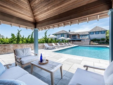 Set along the coveted shores of Dune Road in Quogue, this - photo 24