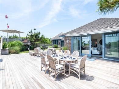 Set along the coveted shores of Dune Road in Quogue, this - photo 27