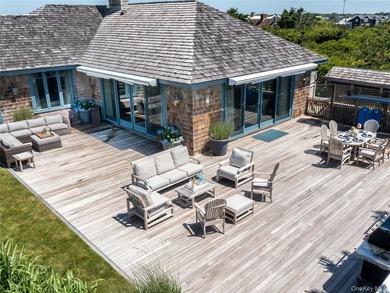 Set along the coveted shores of Dune Road in Quogue, this - photo 28