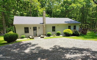 Nestled near Peck's Pond, this 2 bedroom ranch home sits on .6 - photo 1