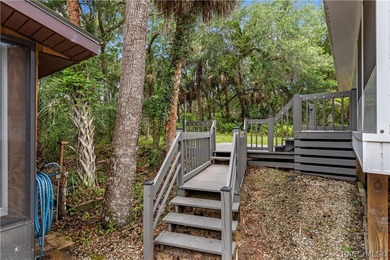 Tucked away on a beautiful wooded 1-acre waterfront lot in the - photo 28