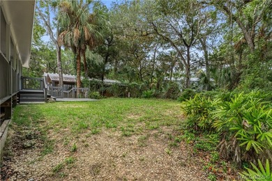 Tucked away on a beautiful wooded 1-acre waterfront lot in the - photo 30