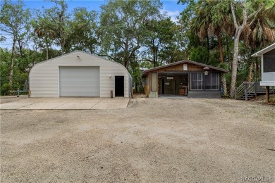 Tucked away on a beautiful wooded 1-acre waterfront lot in the - photo 32