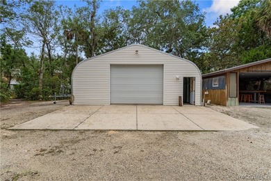 Tucked away on a beautiful wooded 1-acre waterfront lot in the - photo 33