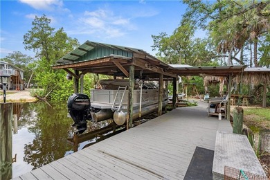 Tucked away on a beautiful wooded 1-acre waterfront lot in the - photo 43