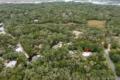 Tucked away on a beautiful wooded 1-acre waterfront lot in the - photo 48