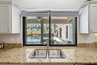 Welcome to this move in ready single-story pool residence in - photo 24