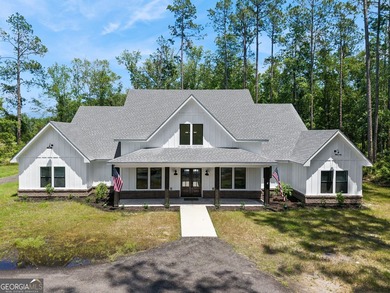 This custom-built home is situated on approximately 3 acres and - photo 1