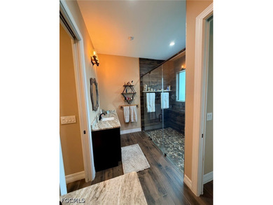 Located at 190 2nd St SE in Naples, this 2.5 acre retreat offers - photo 33