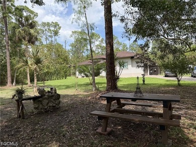 Located at 190 2nd St SE in Naples, this 2.5 acre retreat offers - photo 46