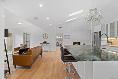 Vaulted ceilings, wide-plank floors, a polished granite - photo 13