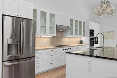 Vaulted ceilings, wide-plank floors, a polished granite - photo 19