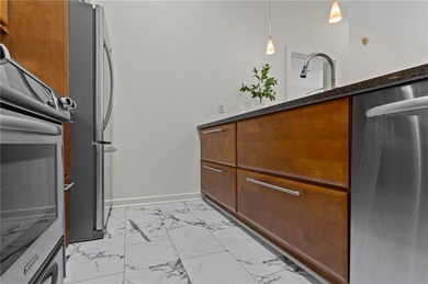 Welcome home to an elevated, turnkey condo experience in the