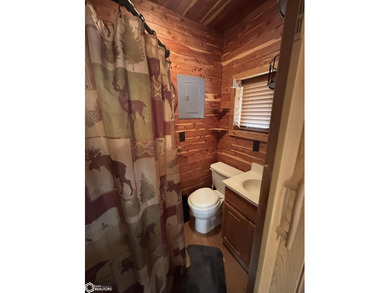 This rustic log a-frame is versatile: a great summer cabin or - photo 17