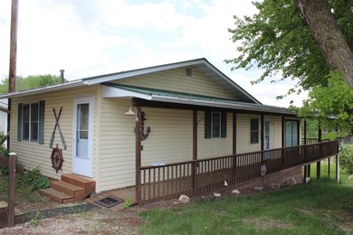 Welcome to 631 N 1st Street, a charming riverfront property - photo 1