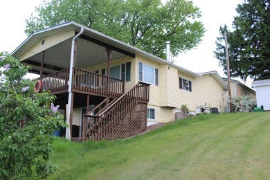 Welcome to 631 N 1st Street, a charming riverfront property - photo 2