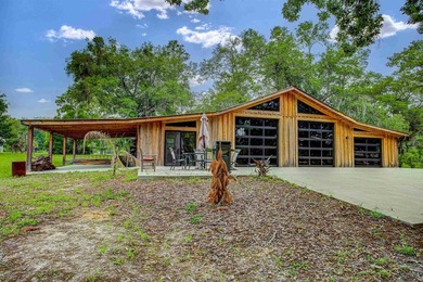 Tucked away on nearly 4.64 private acres, this one-of-a-kind - photo 8