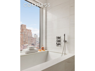 Perched high above the city, this exceptional full-floor - photo 12