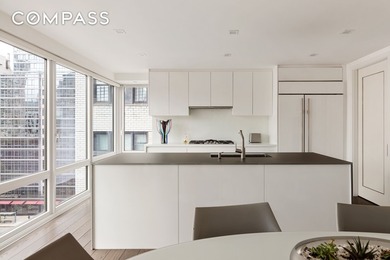 Perched high above the city, this exceptional full-floor - photo 18