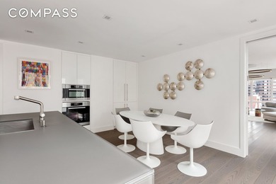 Perched high above the city, this exceptional full-floor - photo 20