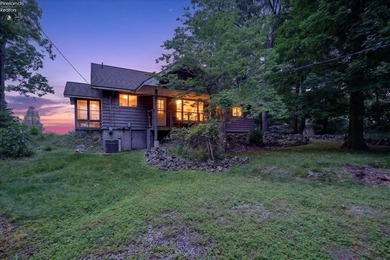Rare opportunity to own a lakefront retreat on highly - photo 1