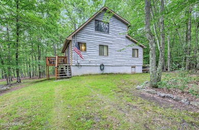 Surrounded by trees in The Hideout, a premier four-season - photo 1