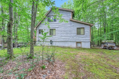 Surrounded by trees in The Hideout, a premier four-season - photo 2