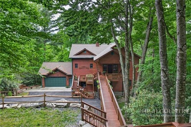 Magnificent home embraced by rhododendrons and hardwood trees - photo 4