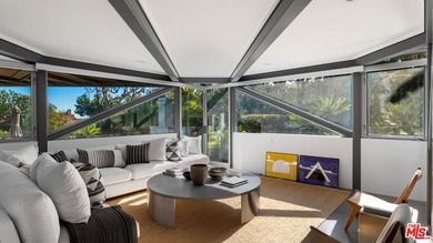 Ocean views, lush natural light, and dramatic angles animate the - photo 14