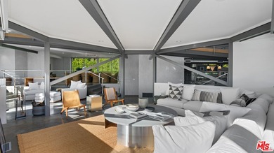 Ocean views, lush natural light, and dramatic angles animate the - photo 15