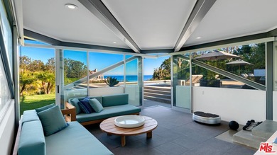 Ocean views, lush natural light, and dramatic angles animate the - photo 17