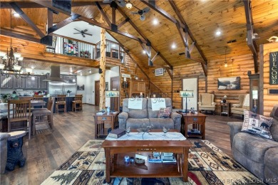 Nestled on a spacious 3.05-acre lot, this stunning shouse offers - Lake Home For Sale in Macks Creek, Missouri