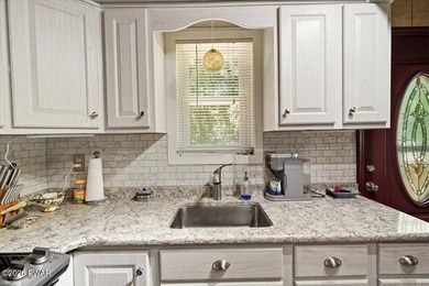 Welcome to this spacious 4-bedroom, 2-bath home nestled in the - photo 7