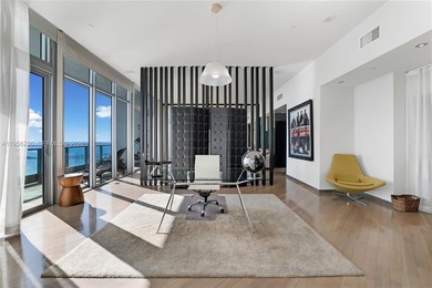 Unobstructed Miami skyline vistas await in this stunning