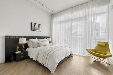 Unobstructed Miami skyline vistas await in this stunning