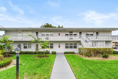 Desirable 1st floor- corner unit (only one neighbor) with