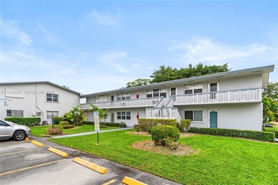 Desirable 1st floor- corner unit (only one neighbor) with