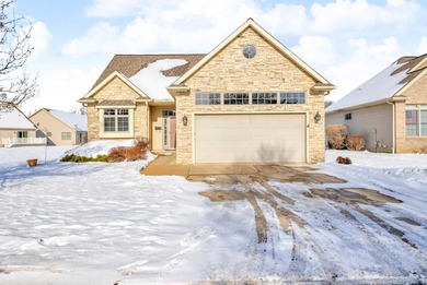 SOUGHT AFTER STAND ALONE CONDO IN SUMMIT TOWNSHIP! Striking curb